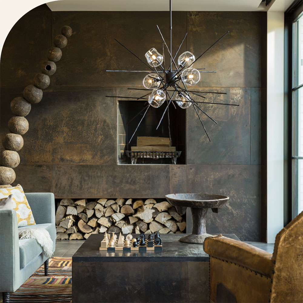 modern chandelier in front of modern fireplace