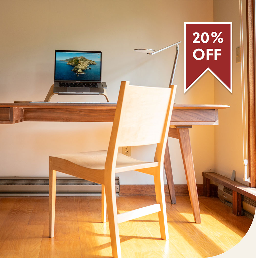 modern wooden desk with chair, computer and task lamp