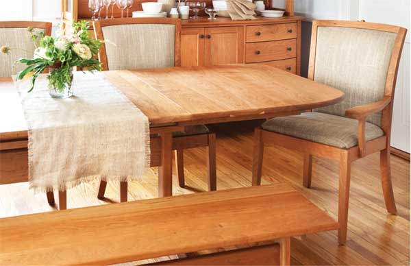 wood table and chairs with a bench in dining room