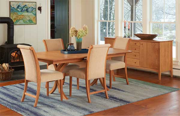 elegant dark wood dining set with cream colored upholstered chairs