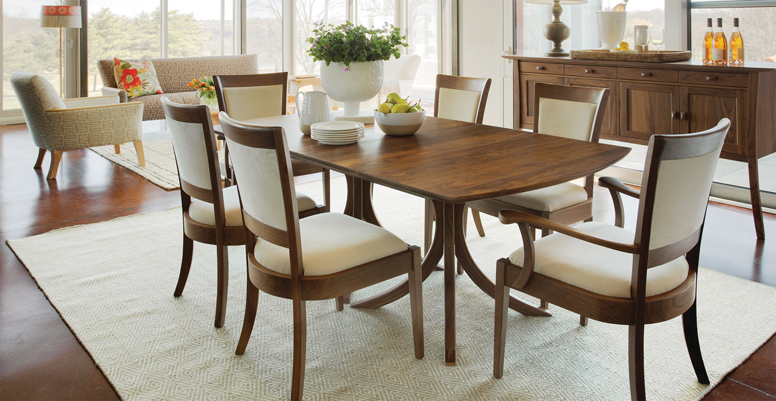 elegant dining room with walnut furniture and white upholstery
