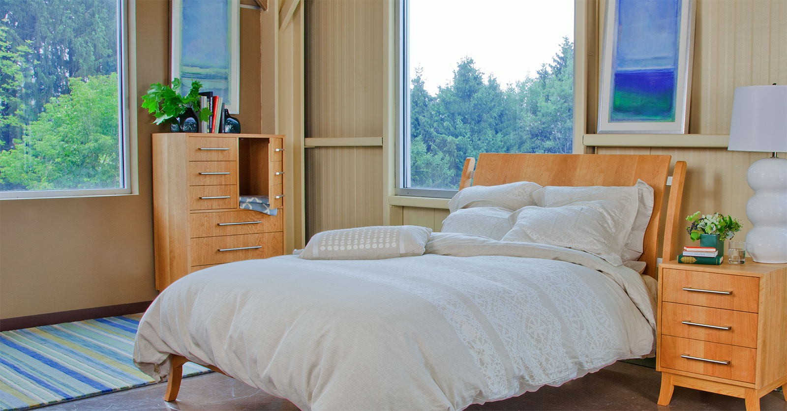 modern, light and airy bedroom with light wood furniture