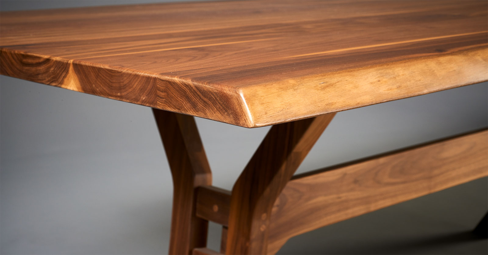 close up of a live edge table in walnut