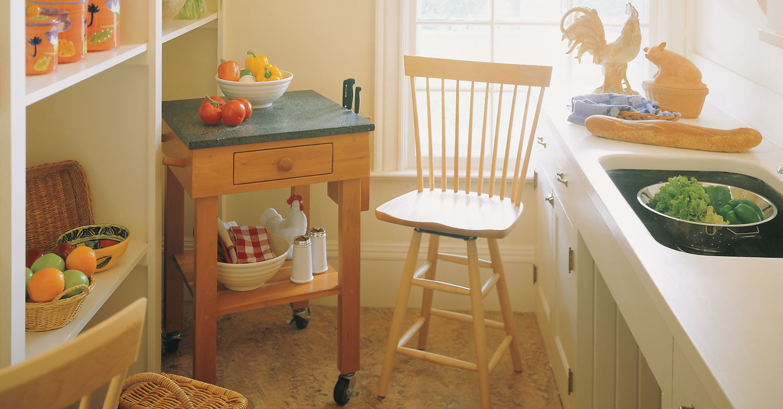 small work table with soapstone top with a windsor barstool