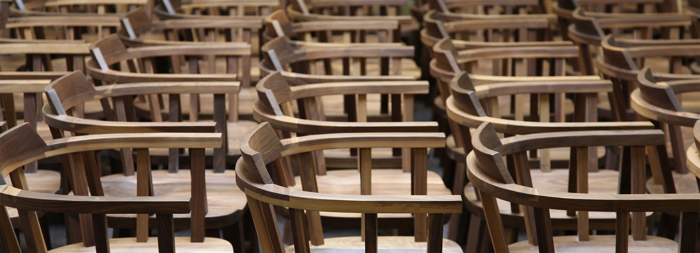 line up of lots of walnut captain chairs