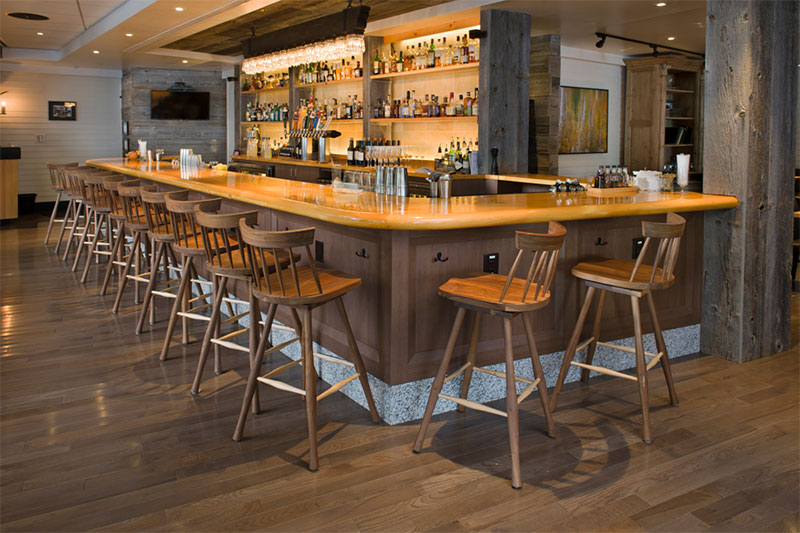 hotel bar with 12 wood barstools