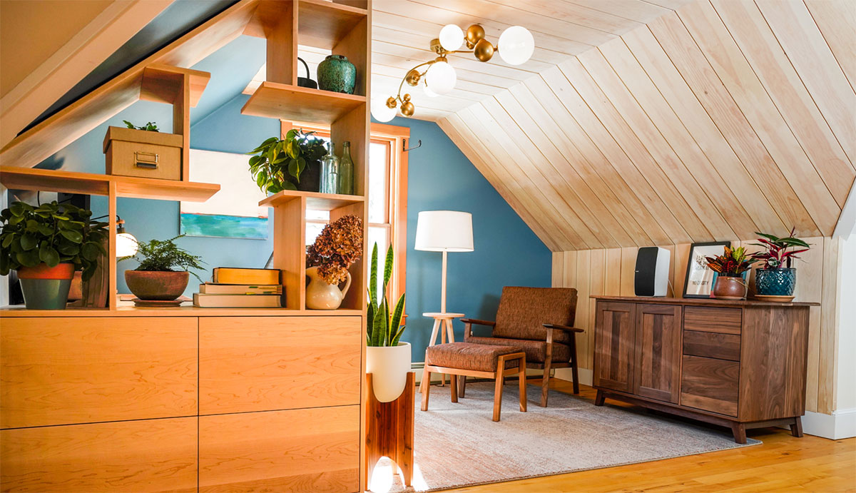 attic home office with teal wall