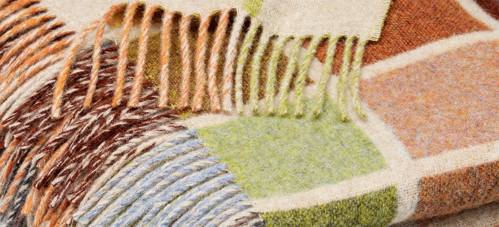 close up of pastel plaid wool throw