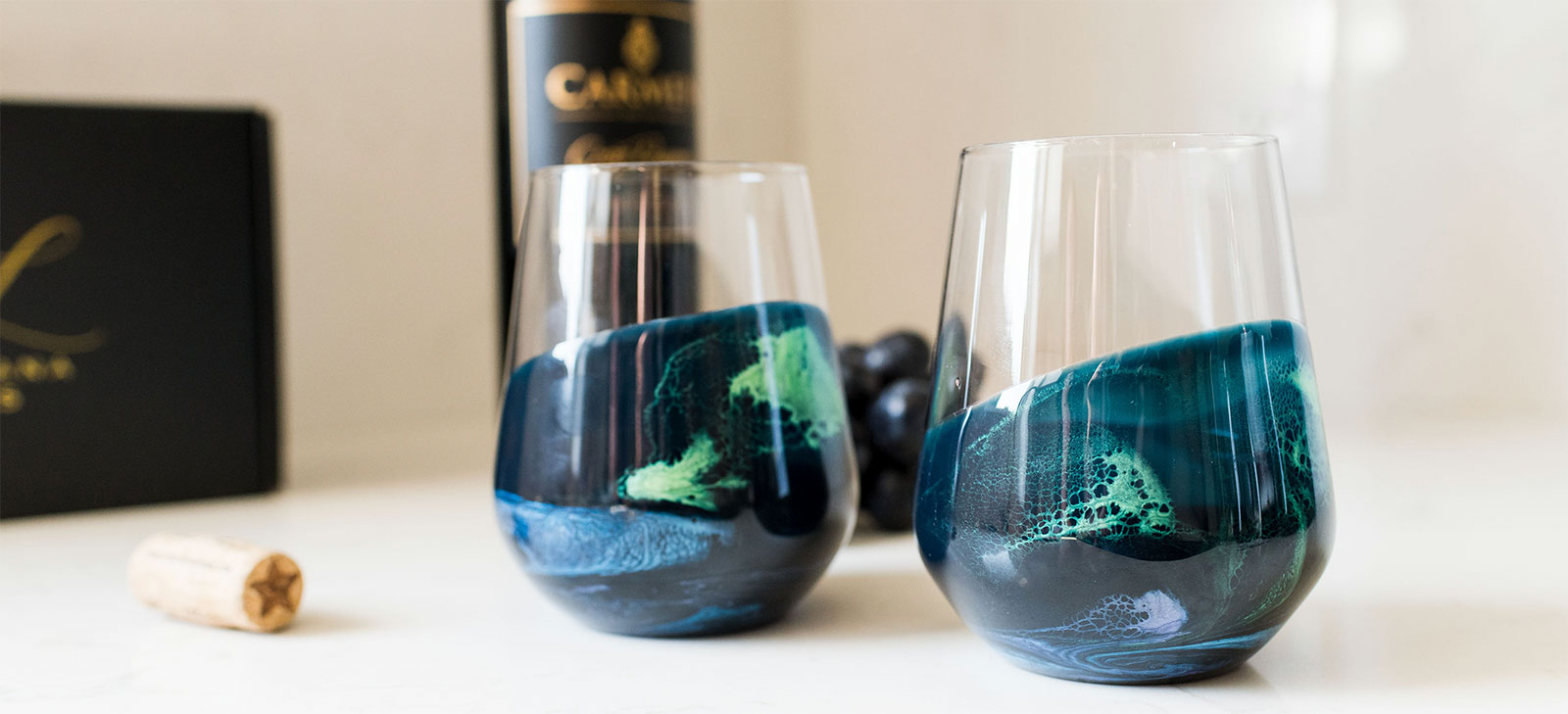 2 cocktail glasses with green resin accents