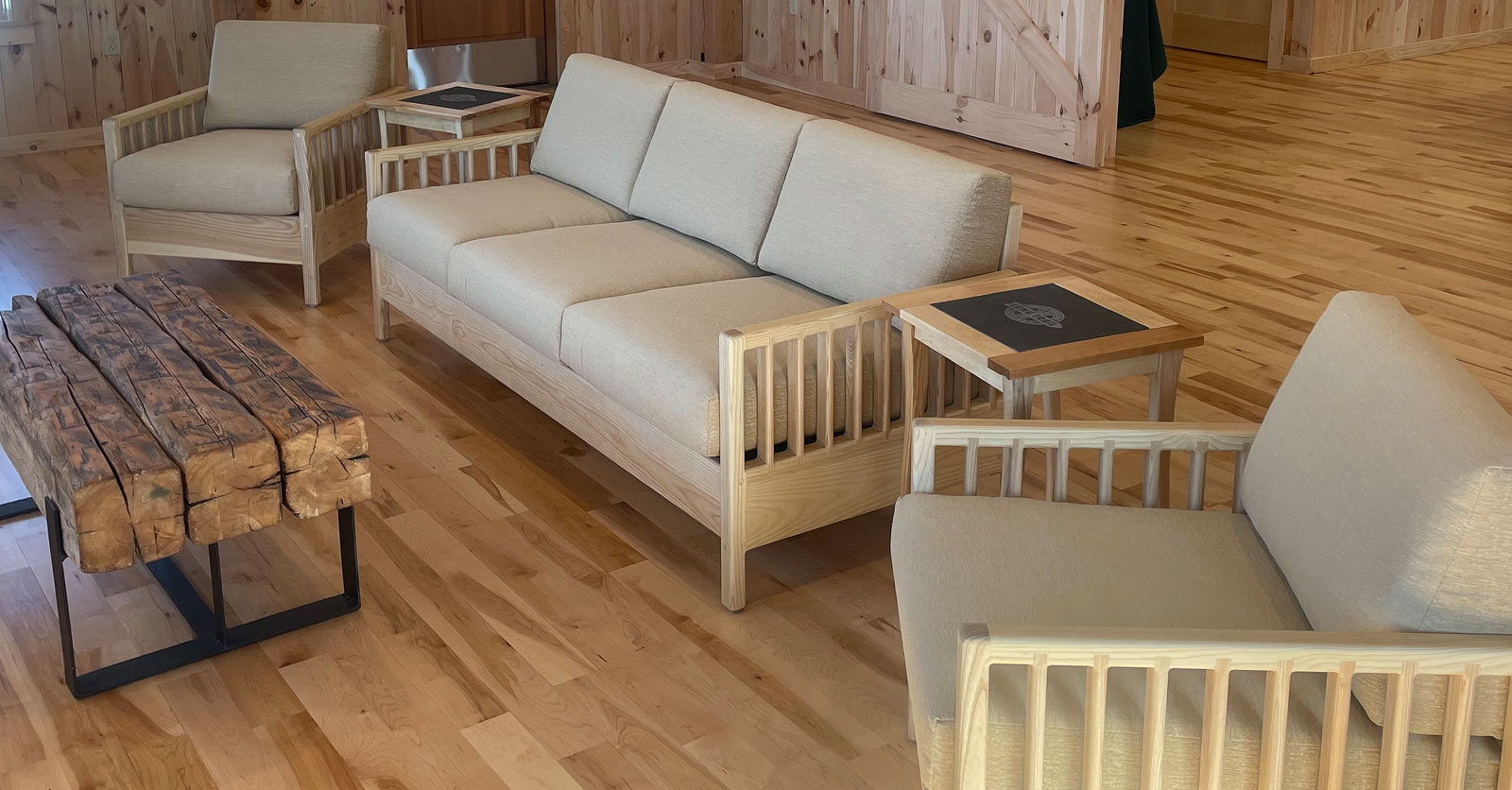 wood framed living room seating in a scandanavian setting