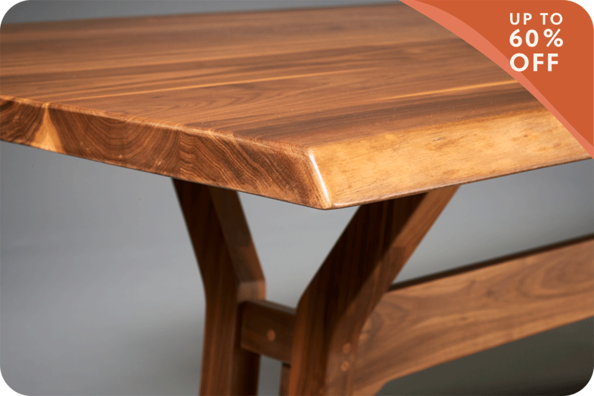 close up of table edge with up to 60% off banner