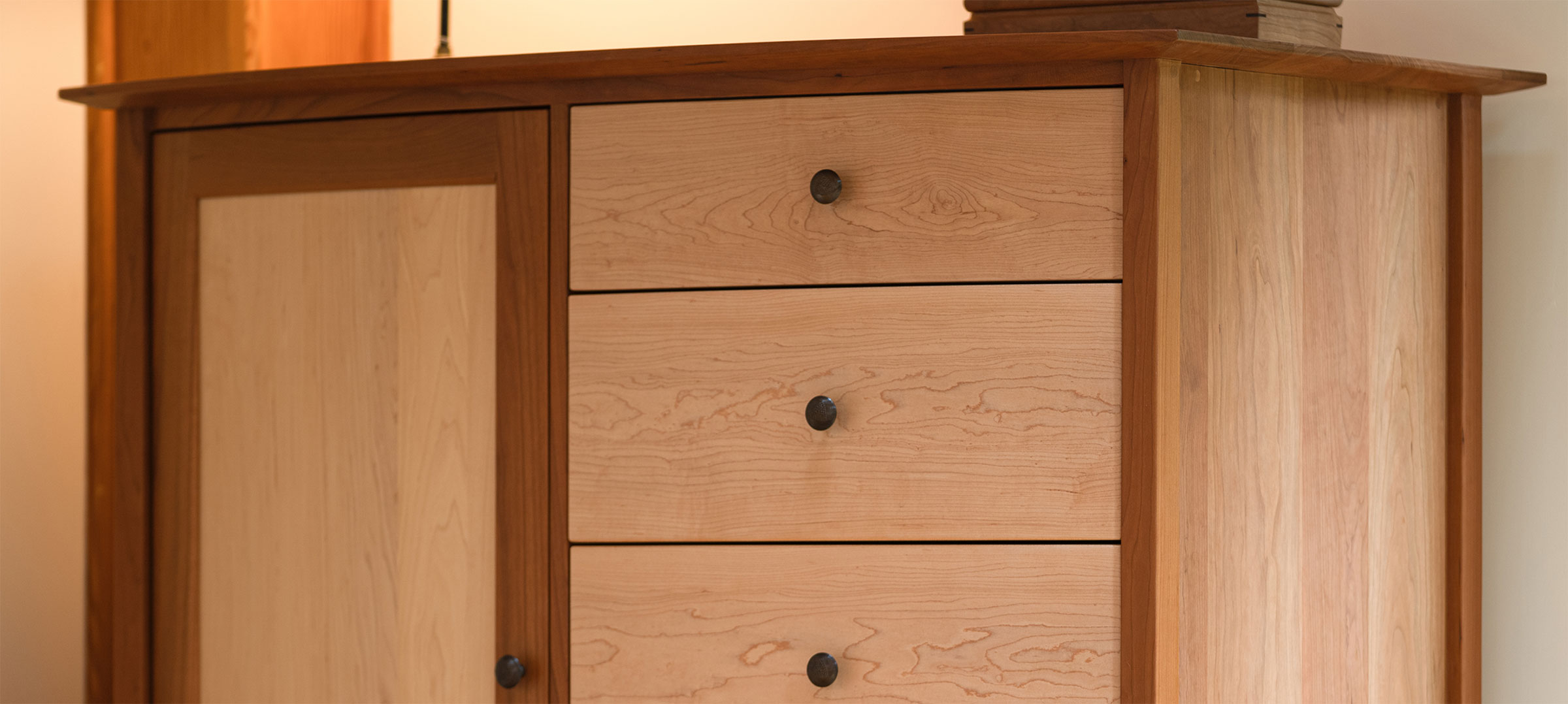 close up of cherry and maple wardrobe