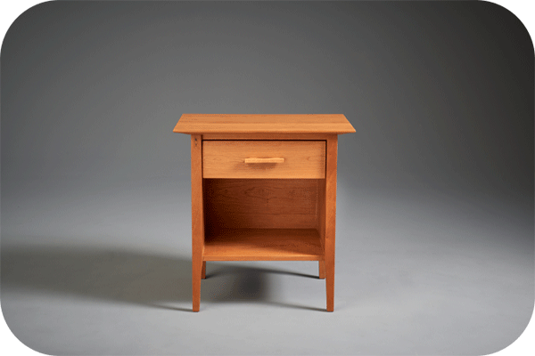 a one drawer cherry nightstand