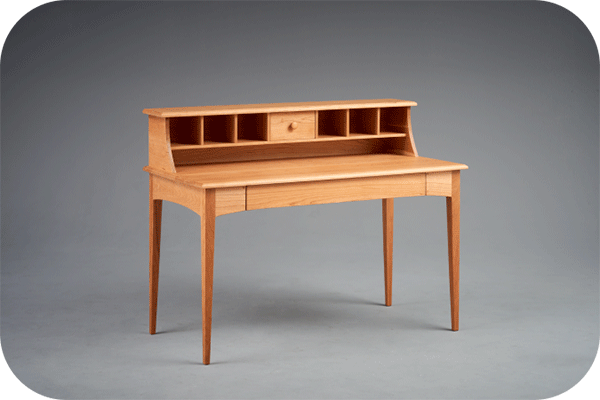 small writing desk with storage cubbies