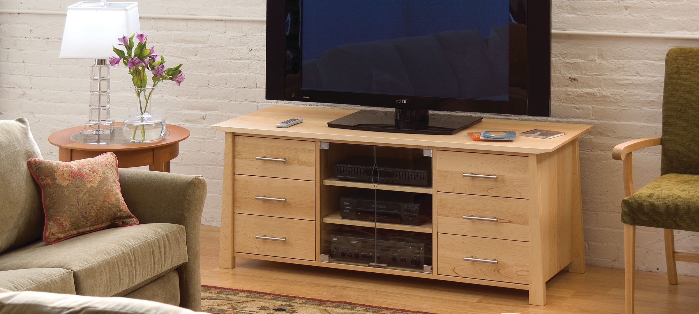 a modern living room with a media cabinet