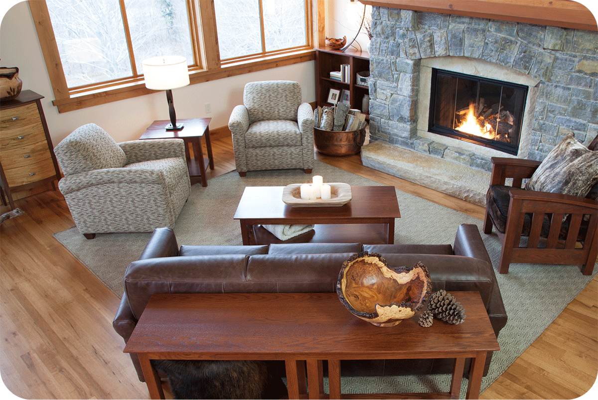 cozy living room seating in front of a huge fireplace