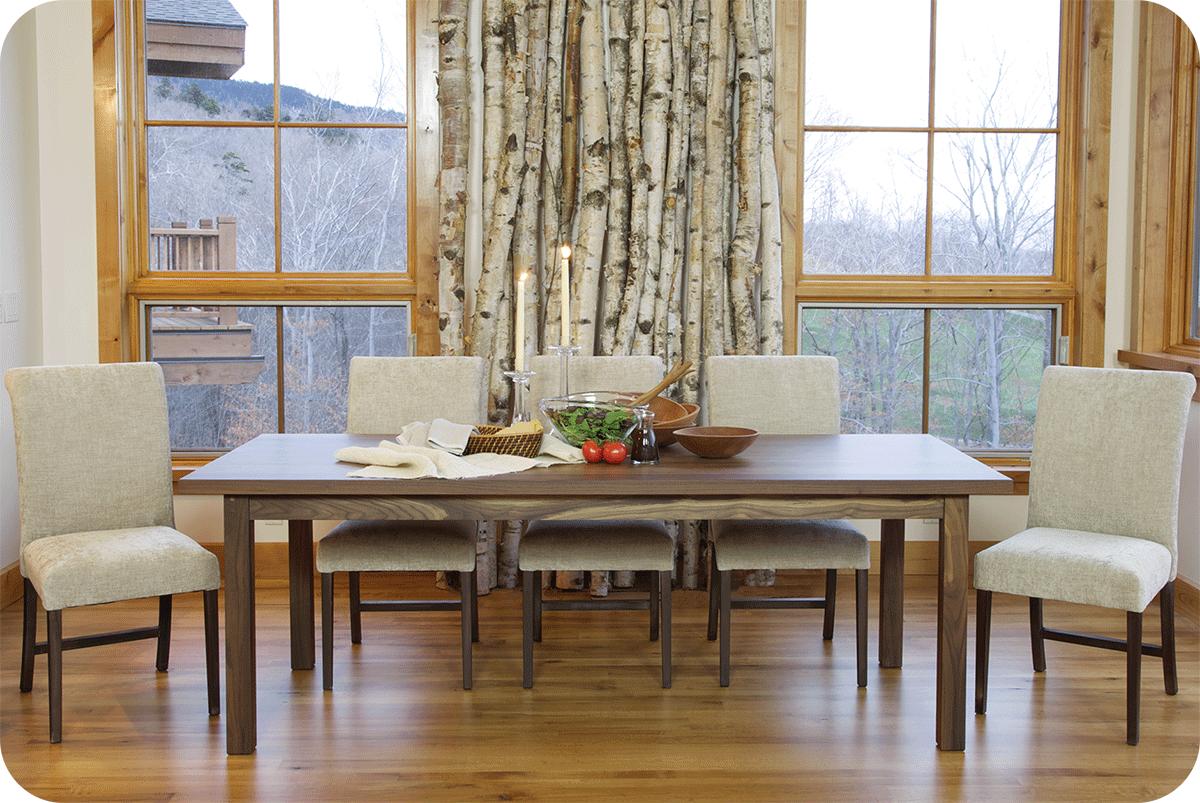 elegant dining room set for the holidays, walnut table with off white upholstered chairs