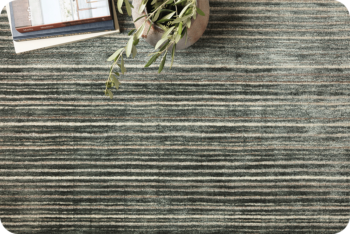 close up of quality greenish striped wool rug