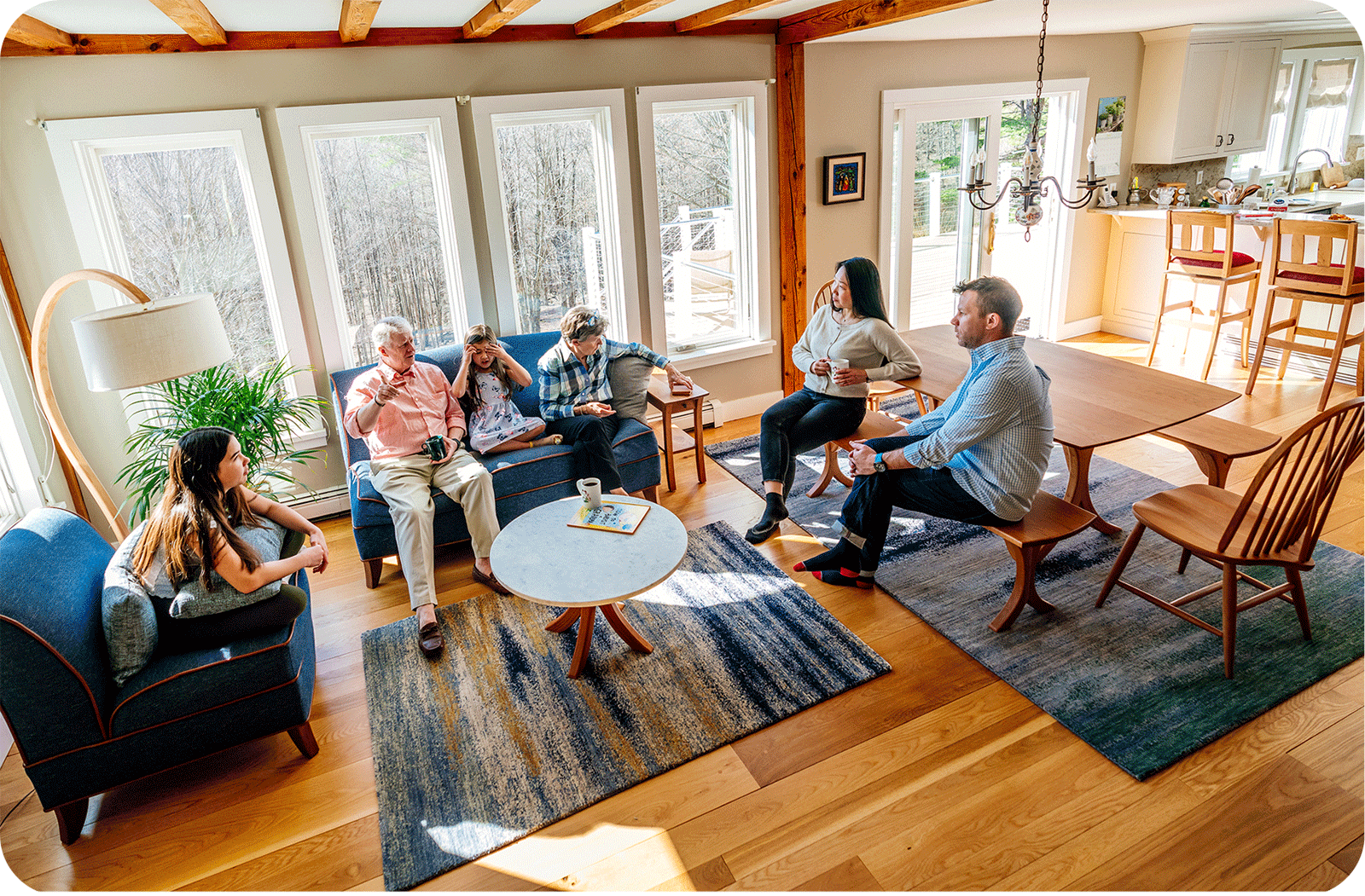 3 generation family hanging out in a houseful of pompy furniture
