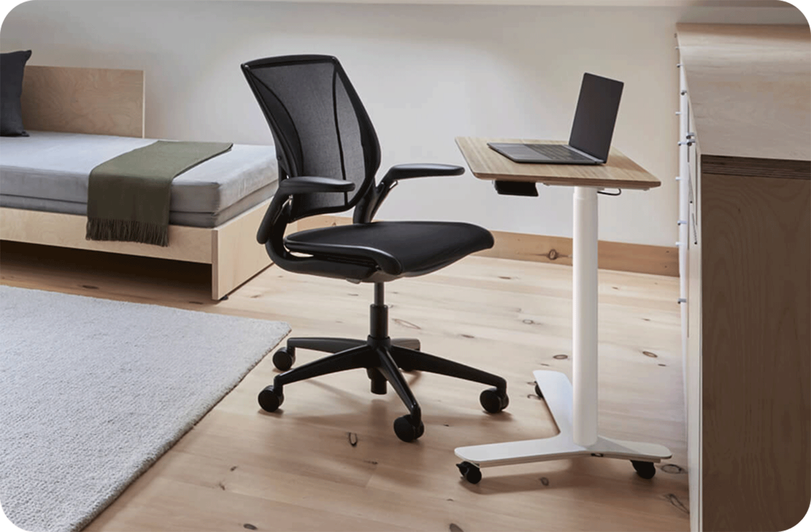 black office chair in modern sparse studio apartment