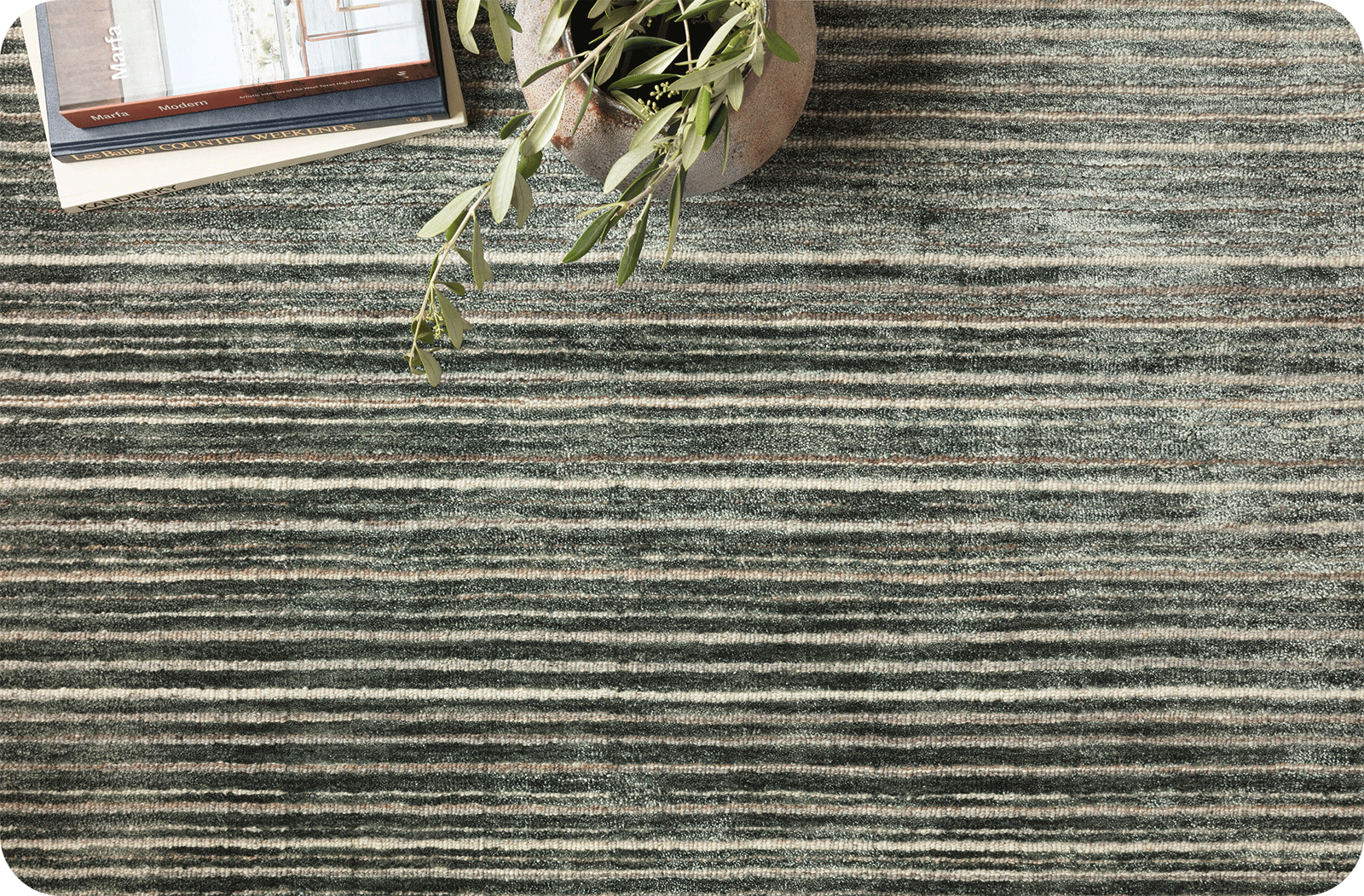 close up of quality greenish striped wool rug