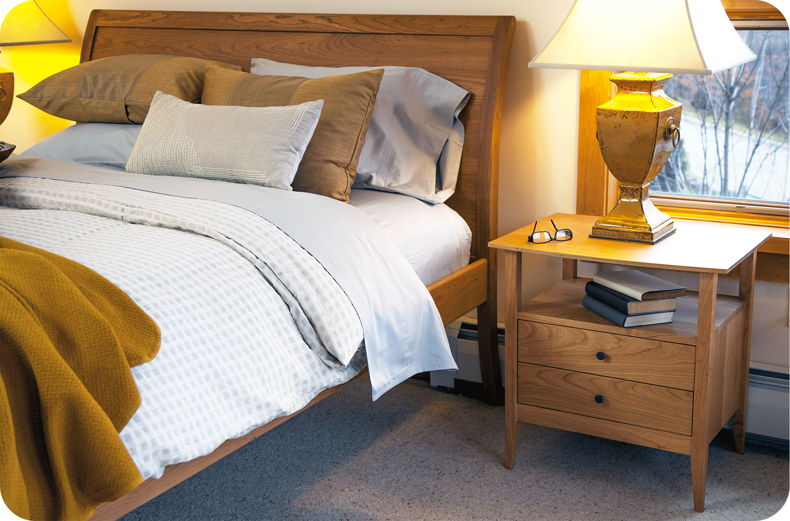 a cozy bedroom with cherry vernon bed and hyde park nightstand