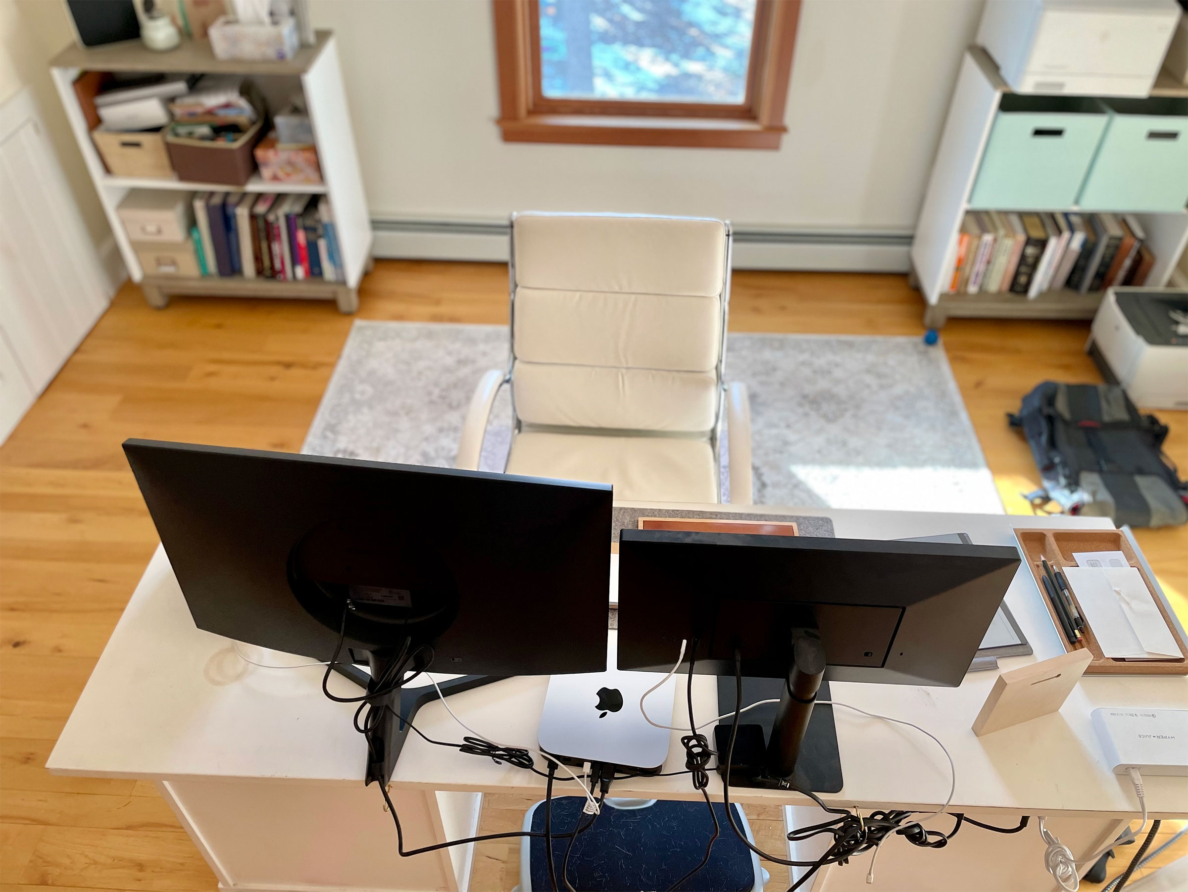 looking down at desk and two monitors