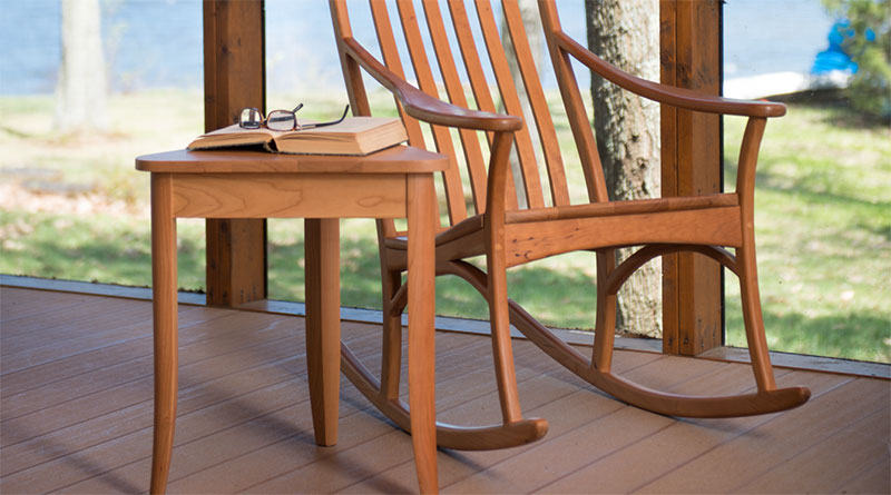 rocking chair base on a screened in porch