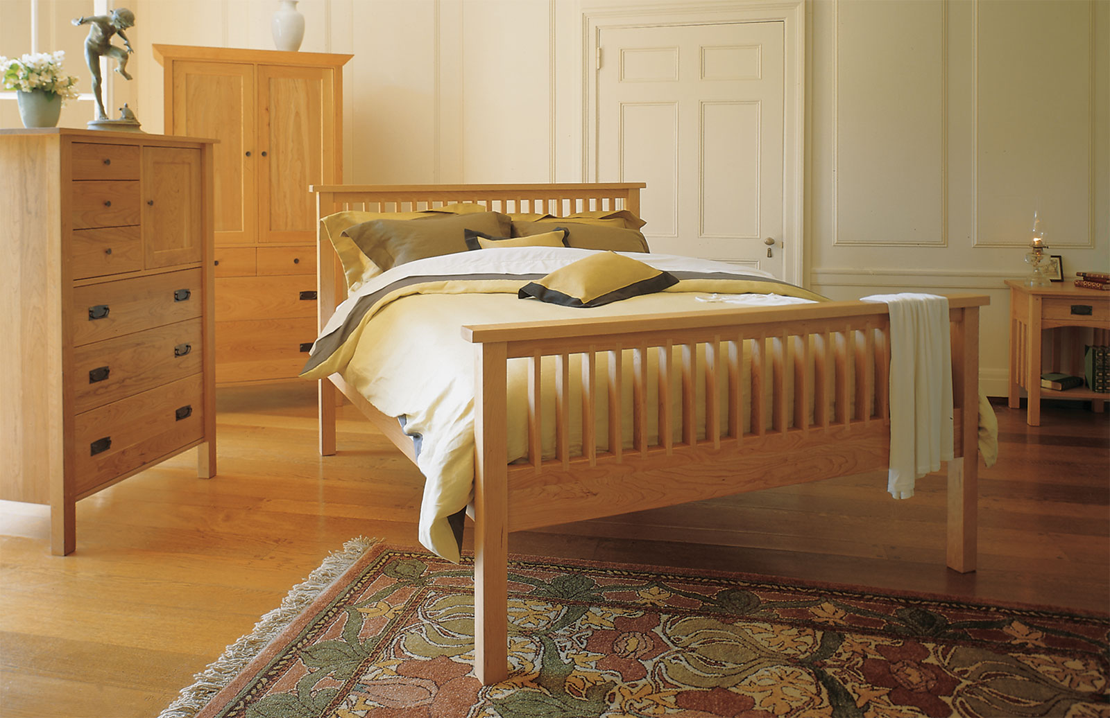 Bed and dresser in walnut and quilted maple.