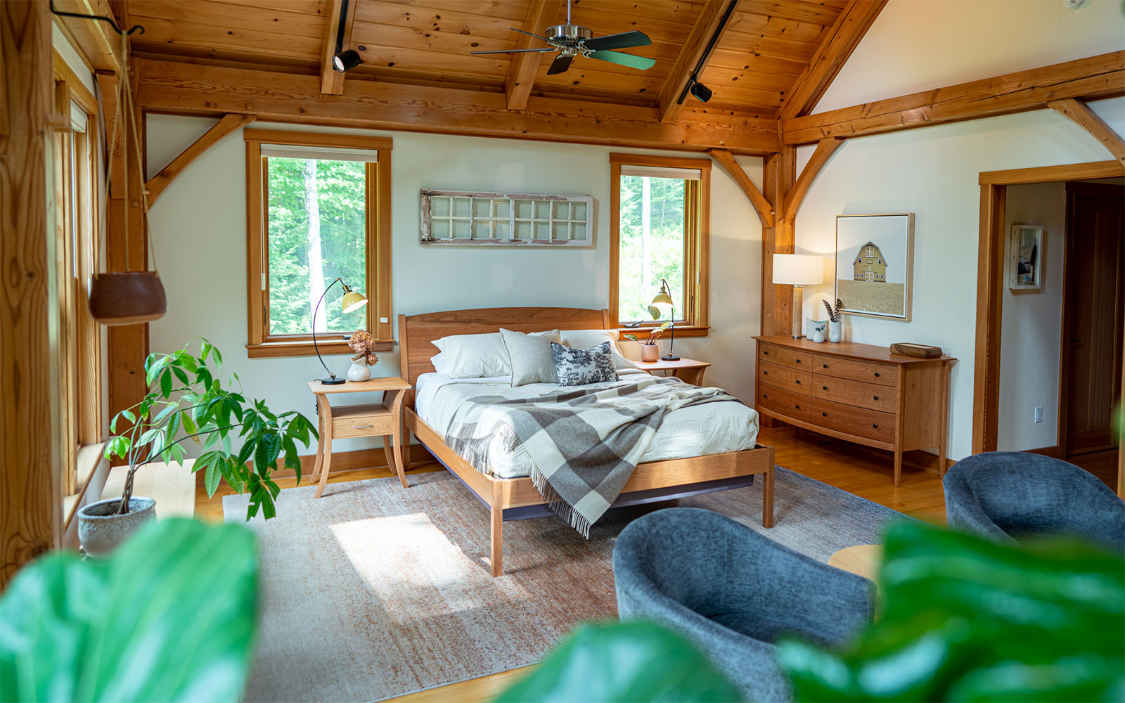 bedroom in post and beam house with plants
