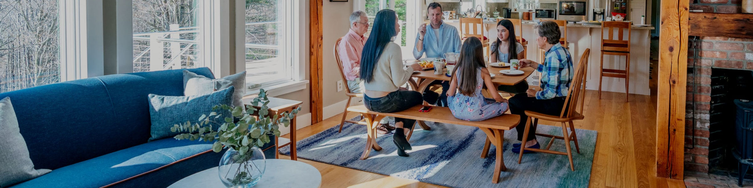 family sitting at dining table