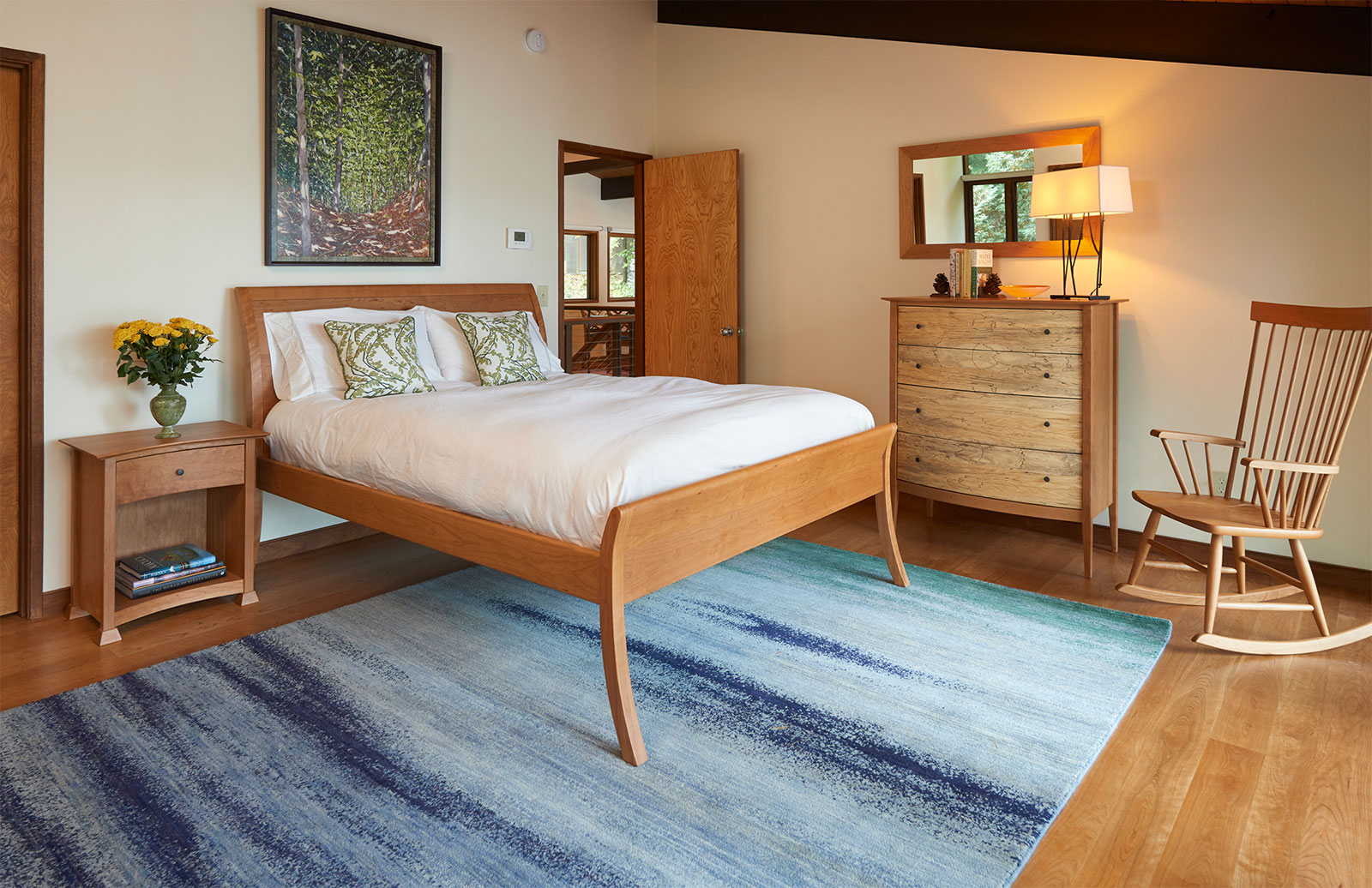 Bed and dresser in walnut and quilted maple.