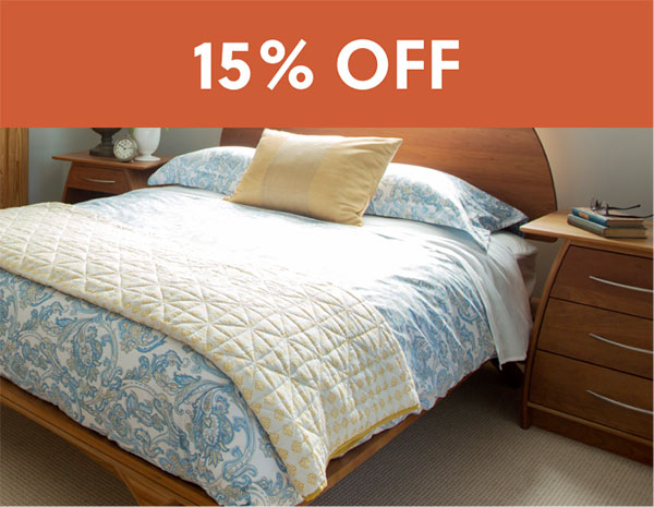 bed with 20% off sign above