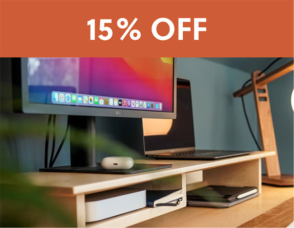 up close of desk shelf and monitor with 20% off sign above