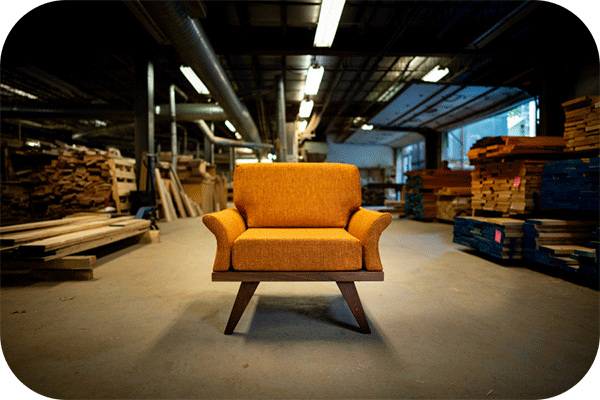 modern orange chair in a woodshop