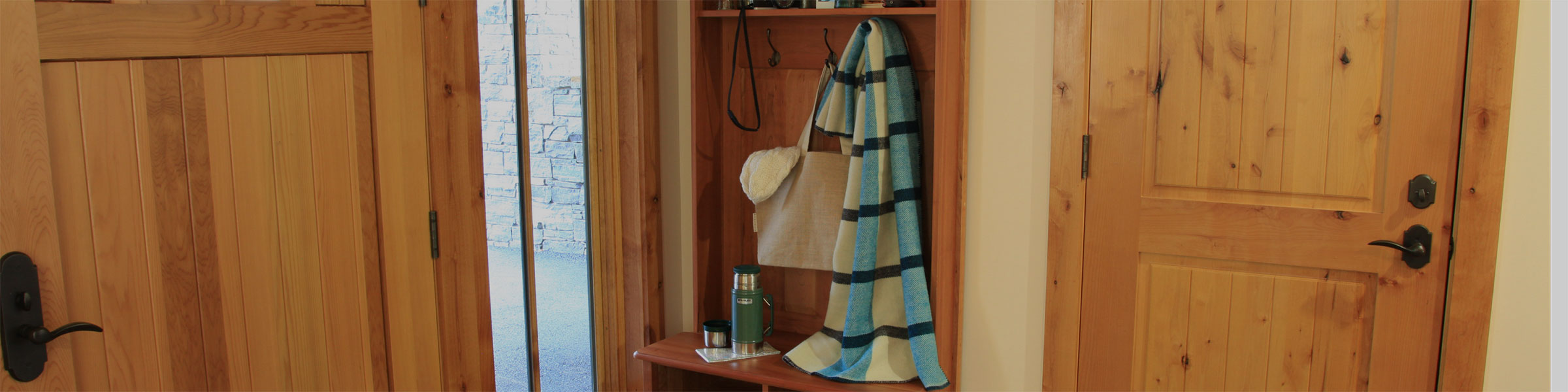 close up of coat hanging in mudroom