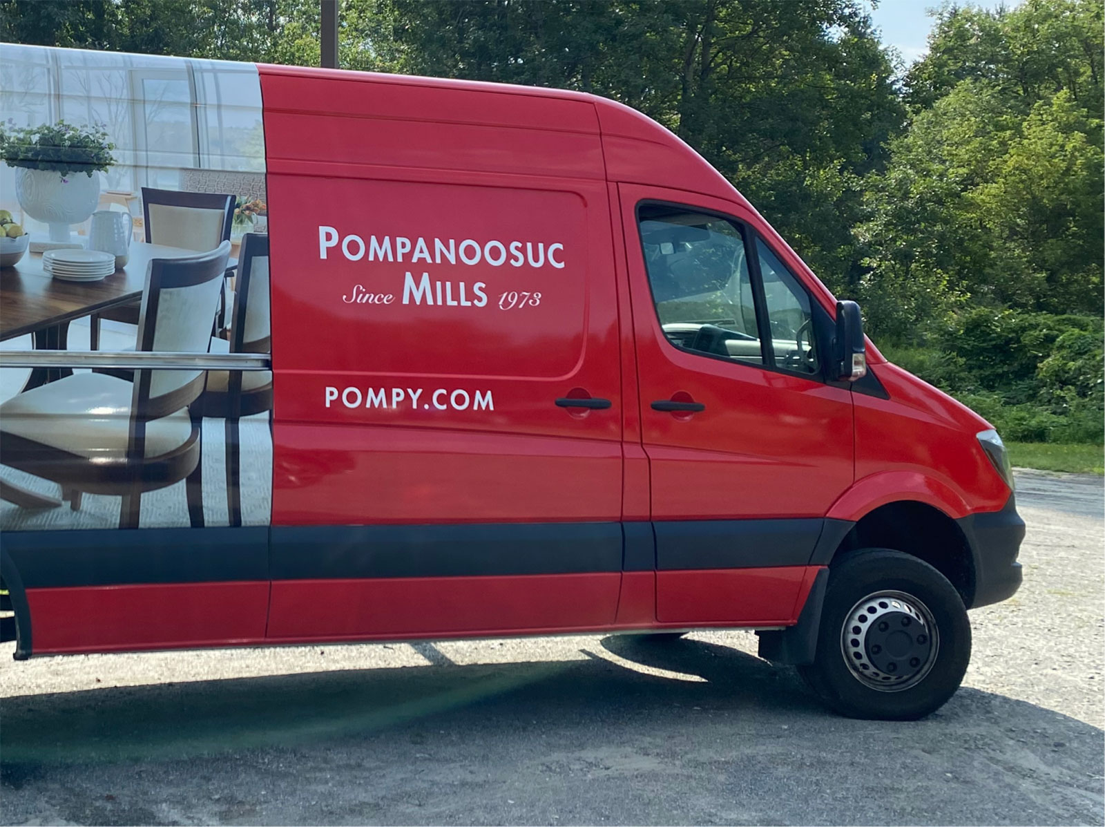 red delivery van with picture of pompanoosuc mills furniture on the side