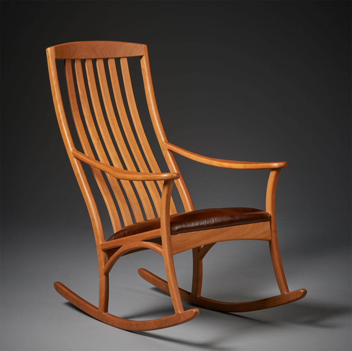 rocking chair in cherry with leather seat